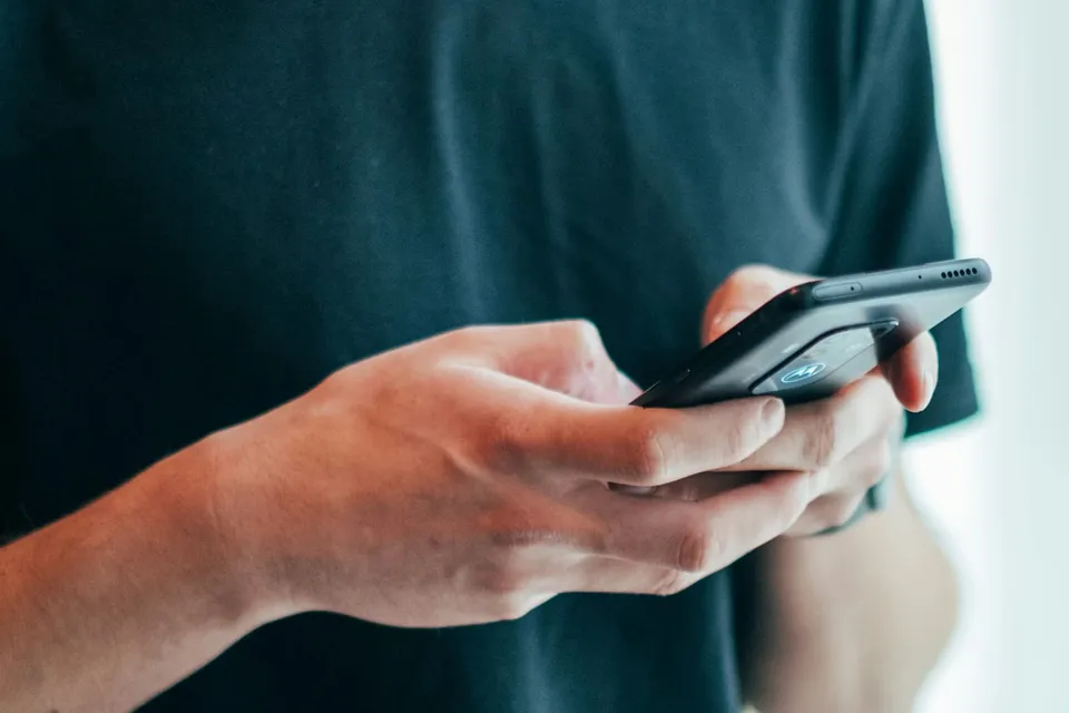 A customer checking a price on his phone