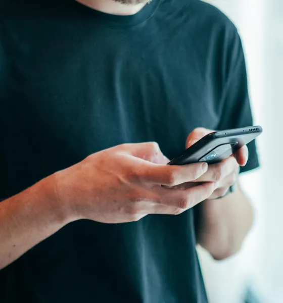 A customer checking a price on his phone