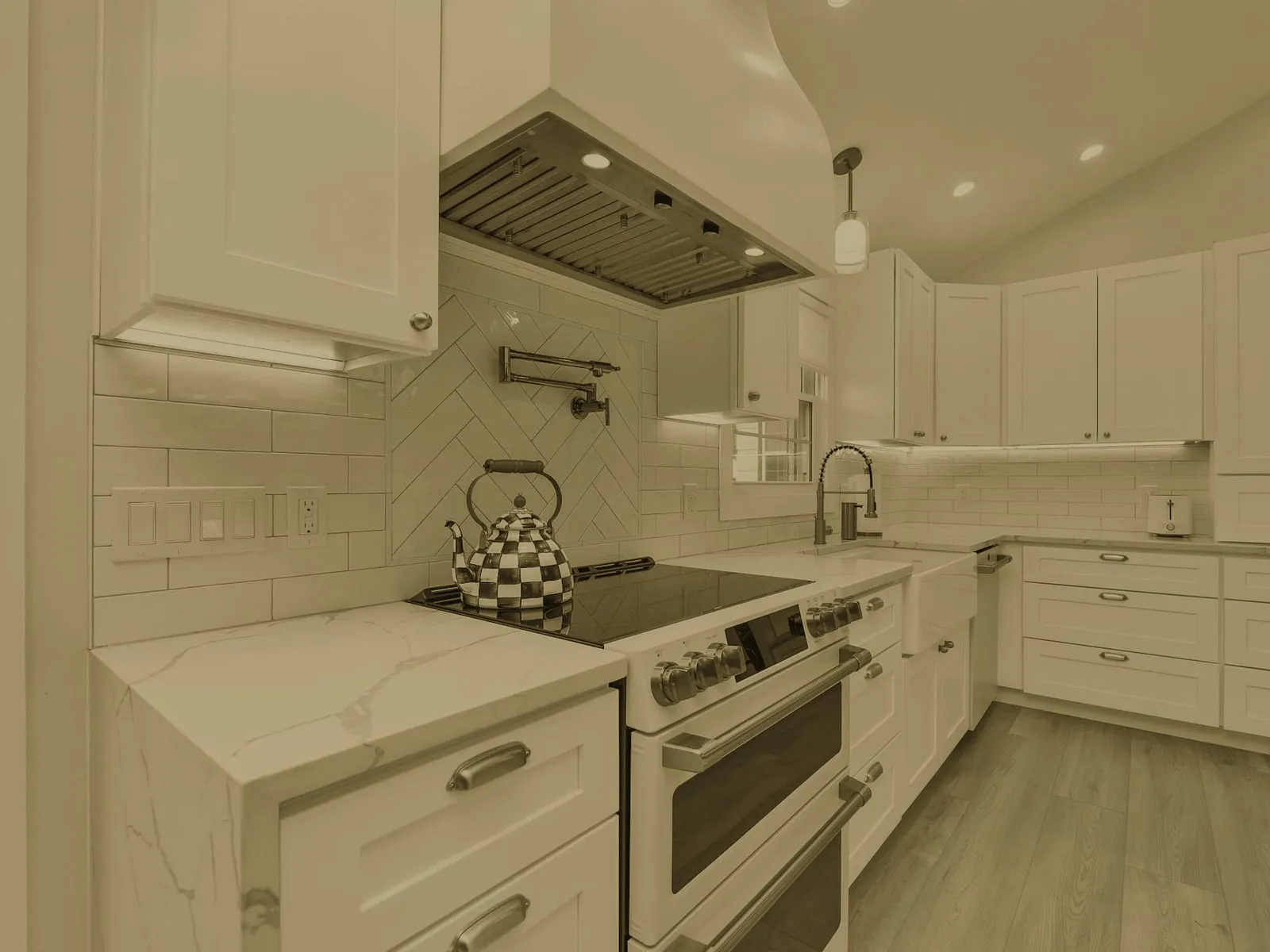 Kitchen before cleaning: dull film on the counters, hob, and backsplash