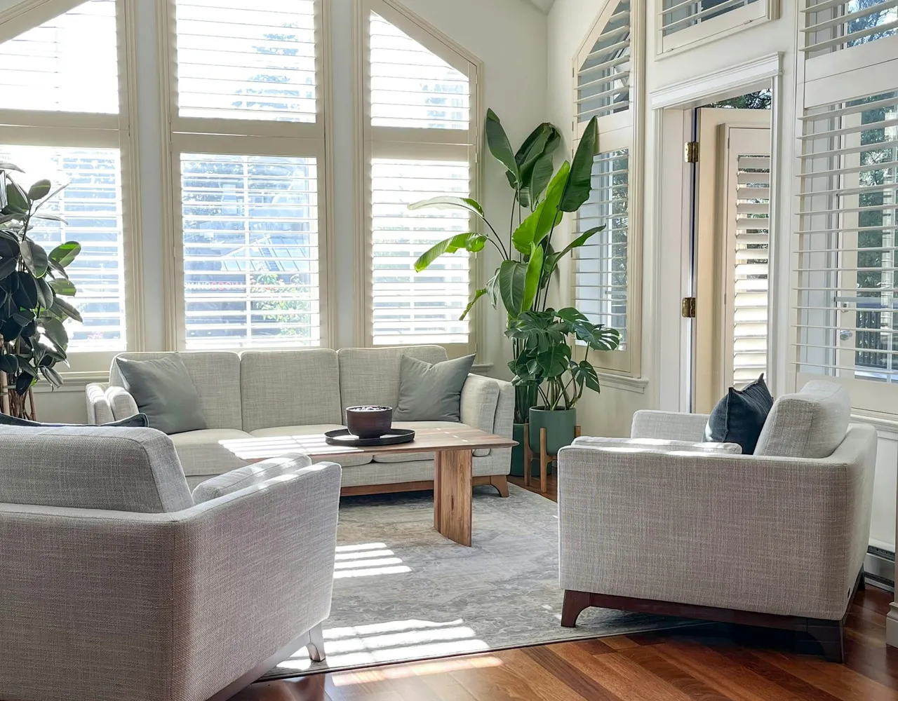 A bright living room with a vaulted ceiling