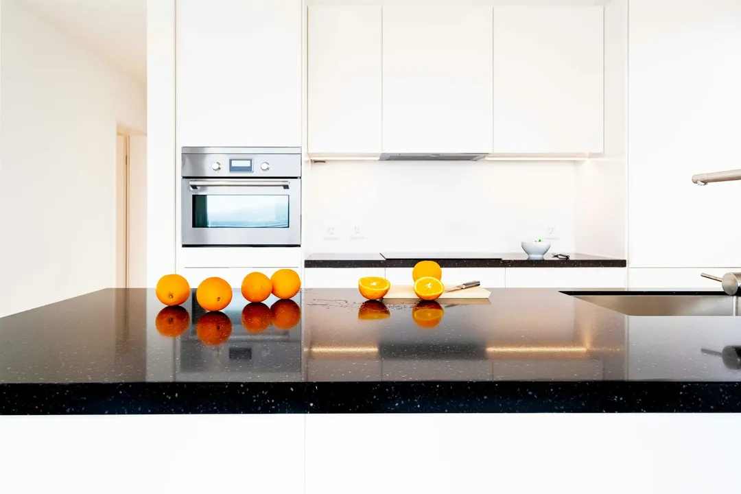 A cleared kitchen counter with the small items packed into a box