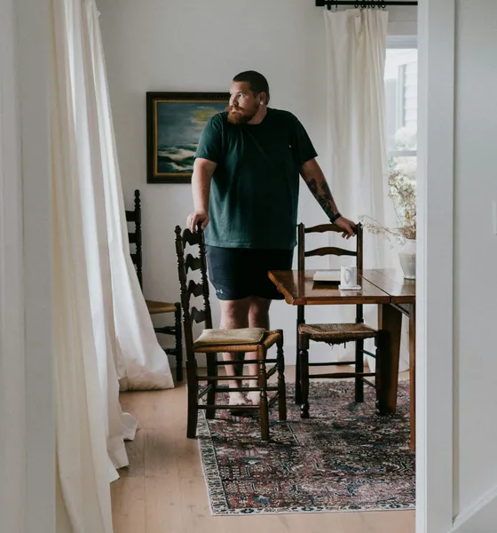 A customer looking over his dining room after the visit