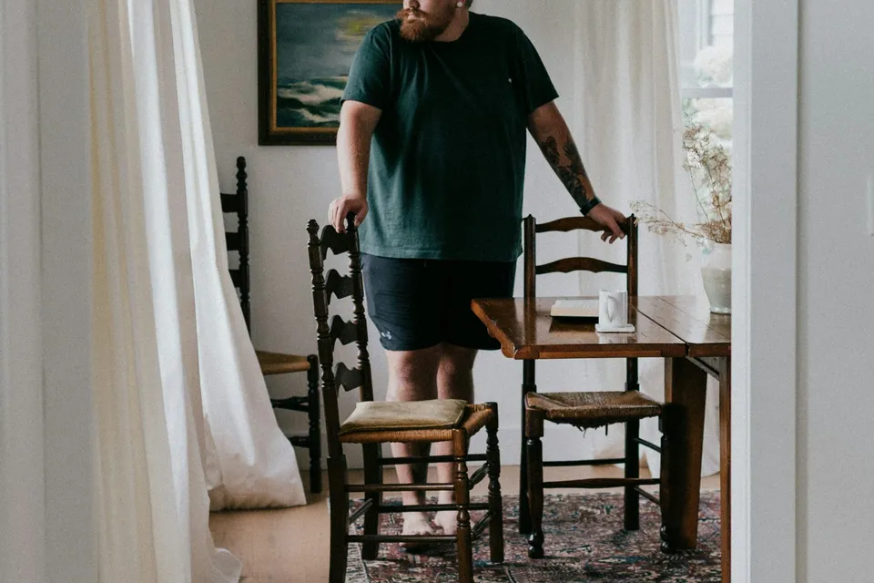 A customer looking over his dining room after the visit